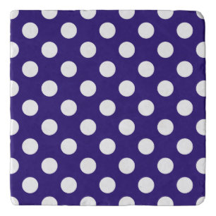 White polka dots on dark blue trivet