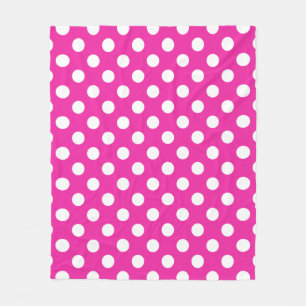 White polka dots on fuchsia fleece blanket