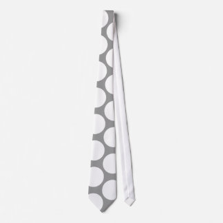 White polka dots on grey neck tie