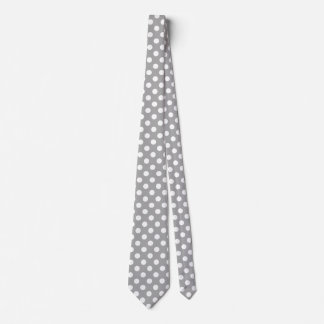 White polka dots on grey tie