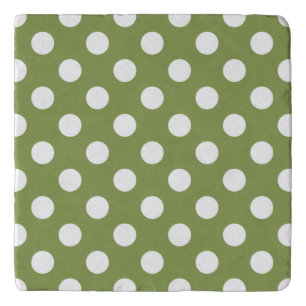White polka dots on olive green trivet