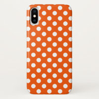 White polka dots on orange