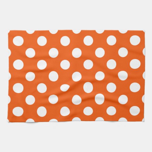 White polka dots on orange kitchen towel