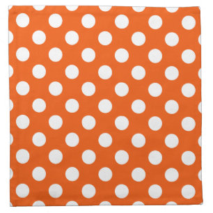 White polka dots on orange napkin
