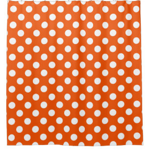 White polka dots on orange shower curtain