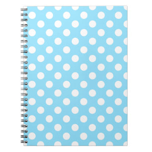 White polka dots on pale blue notebook