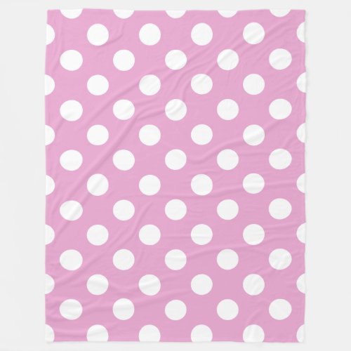 White polka dots on pale pink fleece blanket