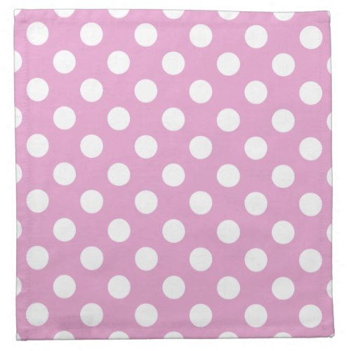 White polka dots on pale pink napkin