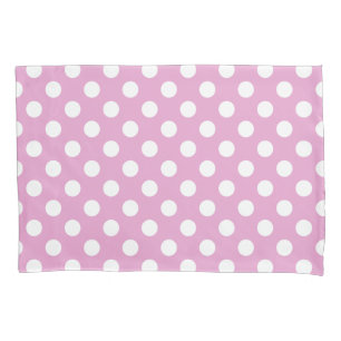 White polka dots on pale pink pillow case