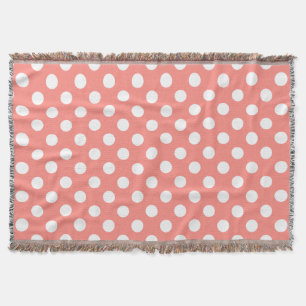 White polka dots on peach throw blanket