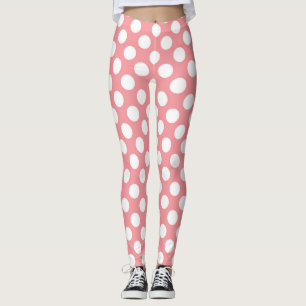 White polka dots on pink background leggings