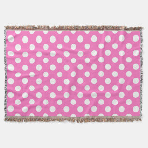 White polka dots on pink throw blanket