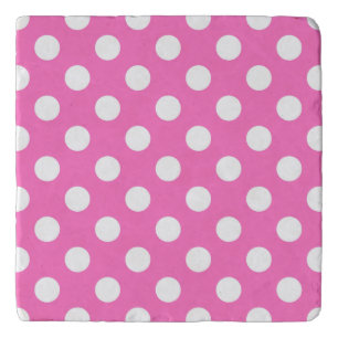 White polka dots on pink trivet