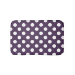 White polka dots on plum purple bathroom mat