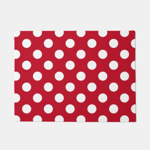 White polka dots on red doormat