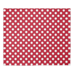 White polka dots on red duvet cover