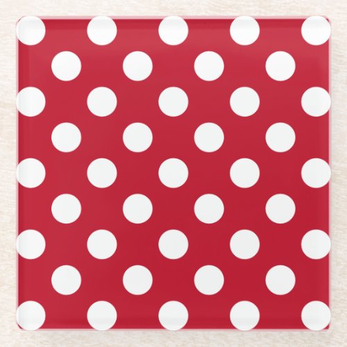 White polka dots on red glass coaster