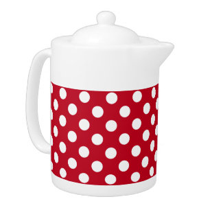 White polka dots on red teapot