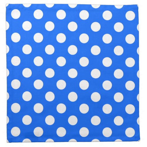 White polka dots on royal blue napkin