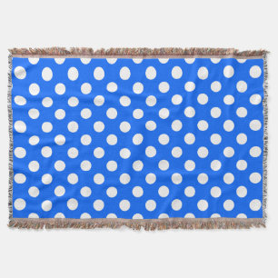 White polka dots on royal blue throw blanket