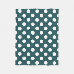White polka dots on teal fleece blanket