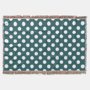 White polka dots on teal throw blanket