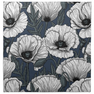 White poppies on navy cloth napkin