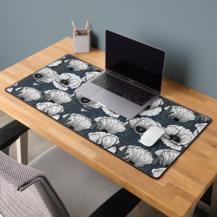 White poppies on navy desk mat