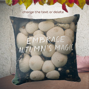 White puffball mushrooms among autumn leaves throw pillow