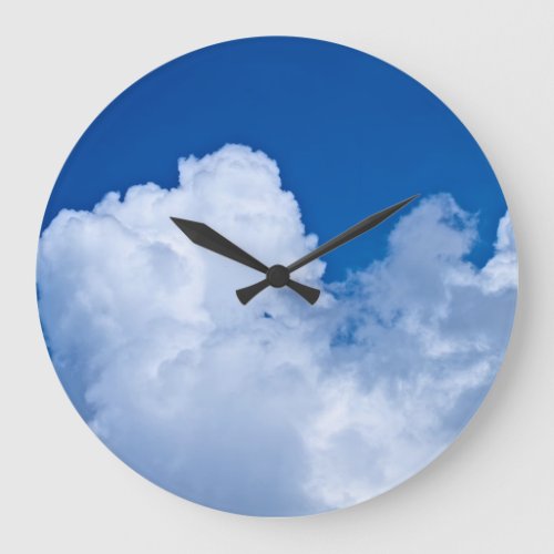 White puffy clouds in blue sky large clock