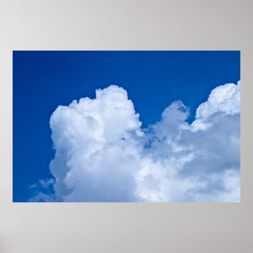 White puffy clouds in blue sky poster