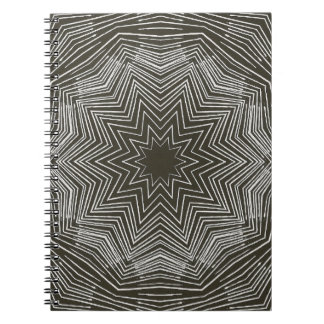 White Pulsating Star Kaleidoscope Pattern on Black Notebook