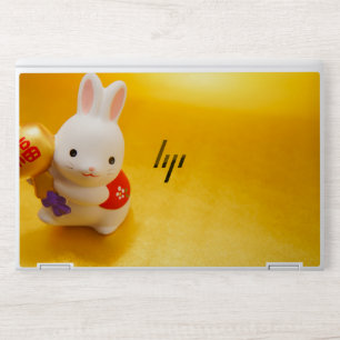 White Rabbit Figurine with Red Vest Holding Gold O HP Laptop Skin