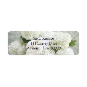 White ranunculus and hydrangeas address label