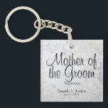 White Reflections Mother of the Groom Wedding Keychain<br><div class="desc">This beautiful keychain is perfect for thanking the Mother of the Groom. Designed as a part of our White Reflections Wedding Suite, it features black text over a background of reflecting white flowers and hearts. The text is fully customizable and reads: Mother of the Bride, with a place for her...</div>