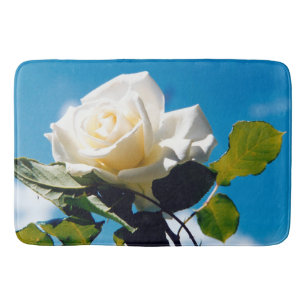 White rose under blue sky bath mat