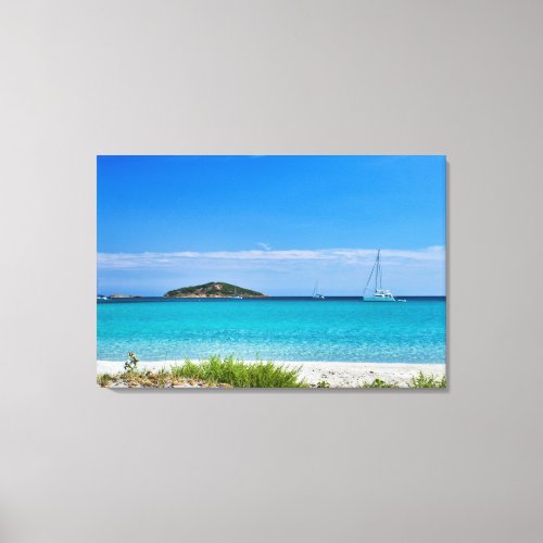 White sand beach turquoise water rocks  sailboat canvas print