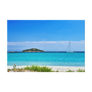 White sand beach turquoise water rocks & sailboat canvas print