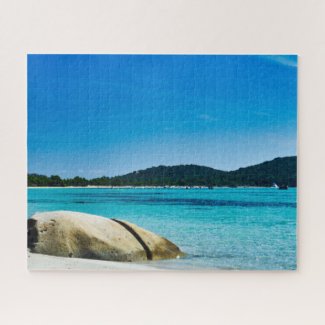 white sand beach with turquoise water and rocks jigsaw puzzle