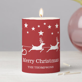White Santa Sleigh And Merry Christmas Text On Red Pillar Candle