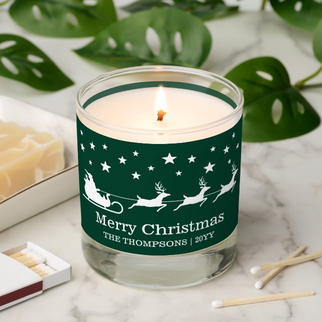 White Santa Sleigh Merry Christmas Text On Green Scented Candle (Lit)