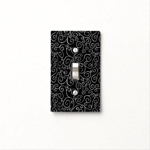 White Scrolling Curves on Black Light Switch Cover