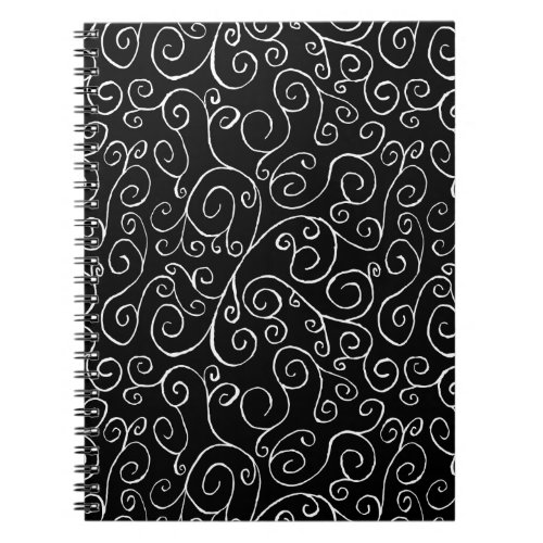 White Scrolling Curves on Black Notebook