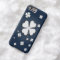 White shamrocks on blue backgrounds