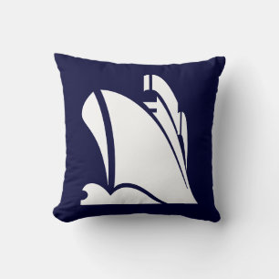 white ship on navy blue pillow