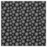 White Snowflake on black with paw print pattern Fabric
