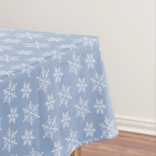 White Snowflake Pattern on Light Blue Tablecloth