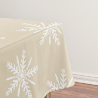 White snowflakes on beige Xmas tablecloth. Tablecloth