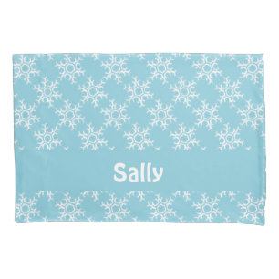 White snowflakes on blue pillow case