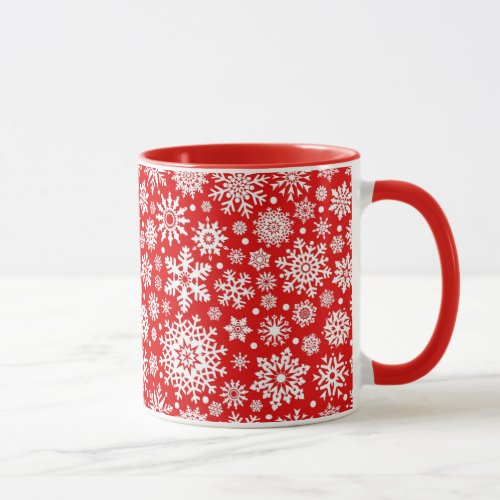 White snowflakes on red mug